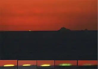 Destello verde de espejismo inferior.