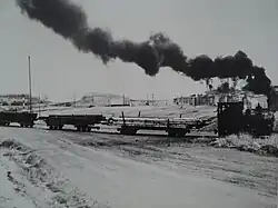 Tren carguero con estrecha relación con el Almacén.