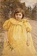 Niña con vestido amarillo.