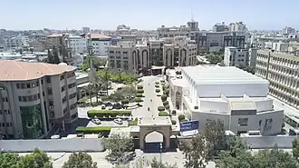 The conference hall (right) and the continuous education building (left) can be seen.