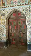 A door and stucco paintings