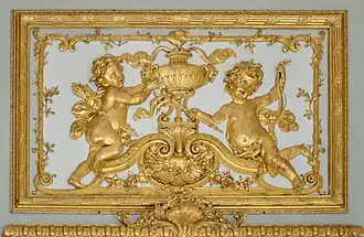 Sobrepuerta hacia la estancia de café: alegoría del Fuego.