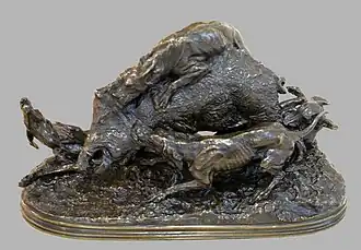 Perros atacando a un cerdo salvaje