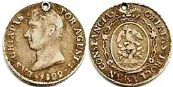 Ejemplo de versión del escudo oficial del Primer Imperio mexicano, en moneda de medio Real, 1822.