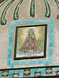 Retablo cerámico de la Virgen de los Desamparados en calle Gómez Ferrer