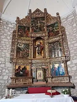 Fotografía del retablo dedicado a San Mamés. Estilo renacentista de tres calles.