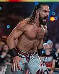 Seth Rollins (L)