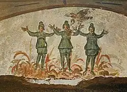 Pintura mural de los primeros cristianos Catacumba de Priscila en Roma, siglos III / IV d.C., que muestra tres figuras en un fuego sobre las cuales vuela una paloma con una rama en el pico.
