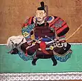 Toyotomi Hideyoshi sentado en la posición agura.