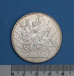 Un peso, Caballito, 1910, plata, reverso. Primera conmemorativa, diseño artista francés Charles Pillet.