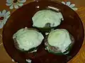 Zapallitos rellenos con salsa blanca